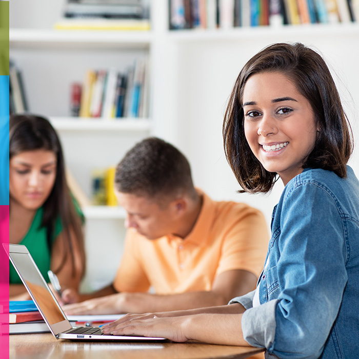 photo of female student studying on her comuter
